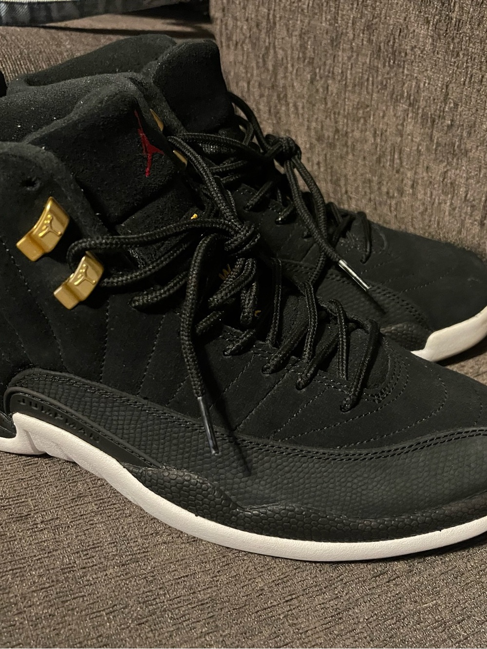 Jordan Black High-Top Sneakers with Gold Accents and White Sole